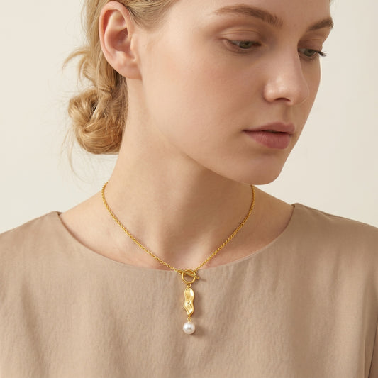 Peanut-shaped freshwater pearl toggle necklace - worn on neck