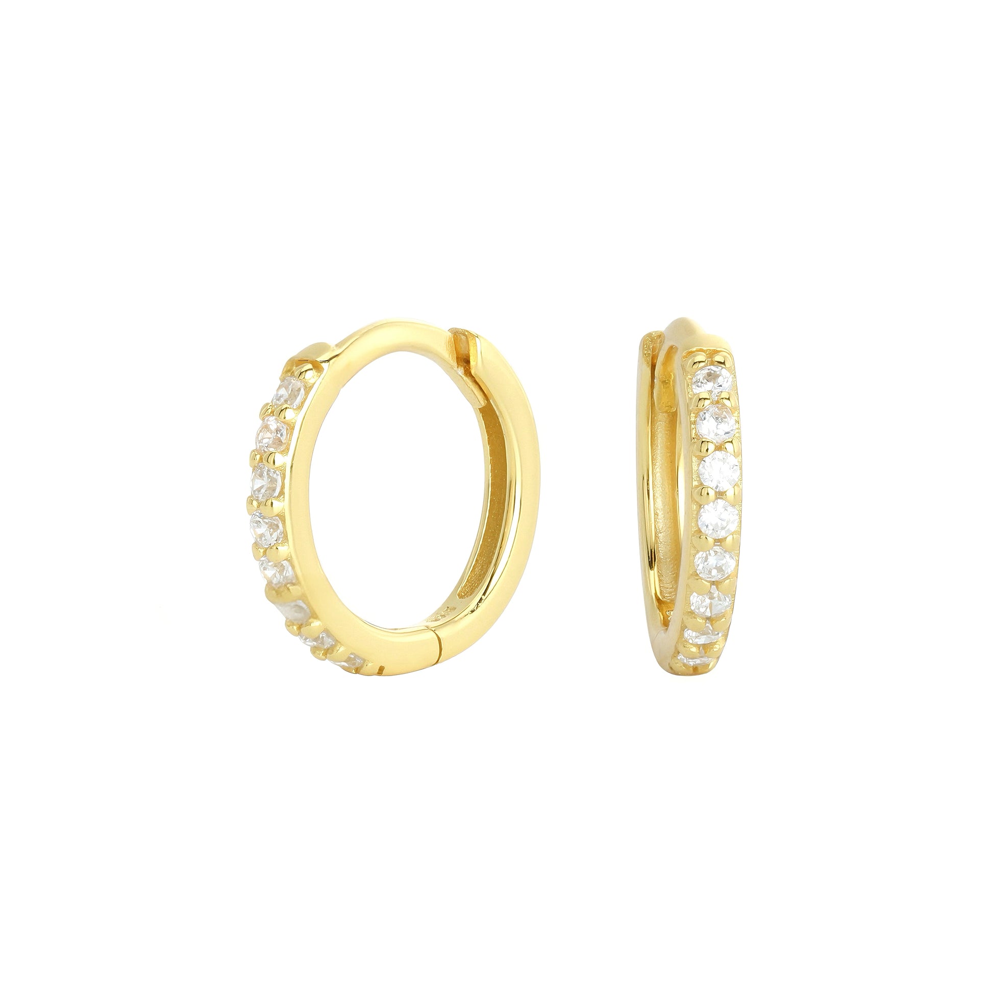 Close-up view of gold plated cz huggie hoop earrings