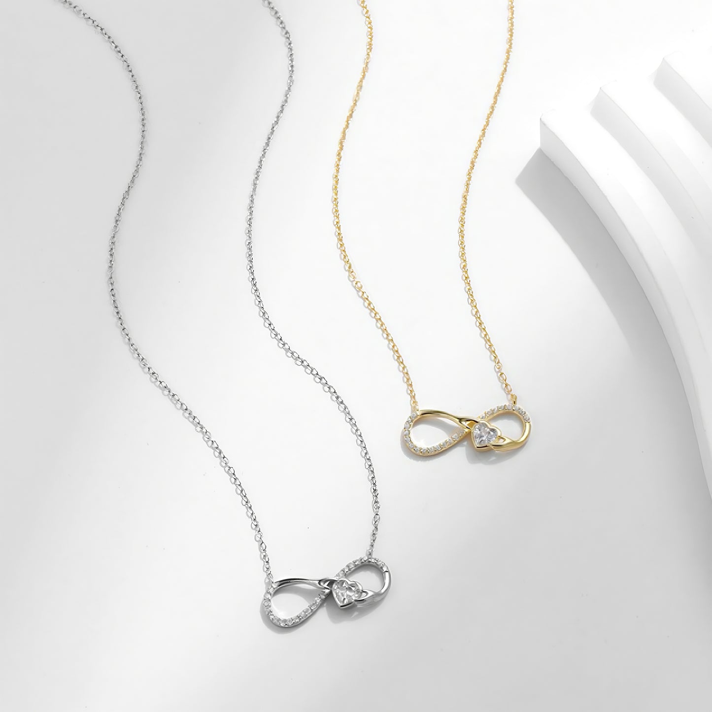 Gold and silver infinity cz necklace side view