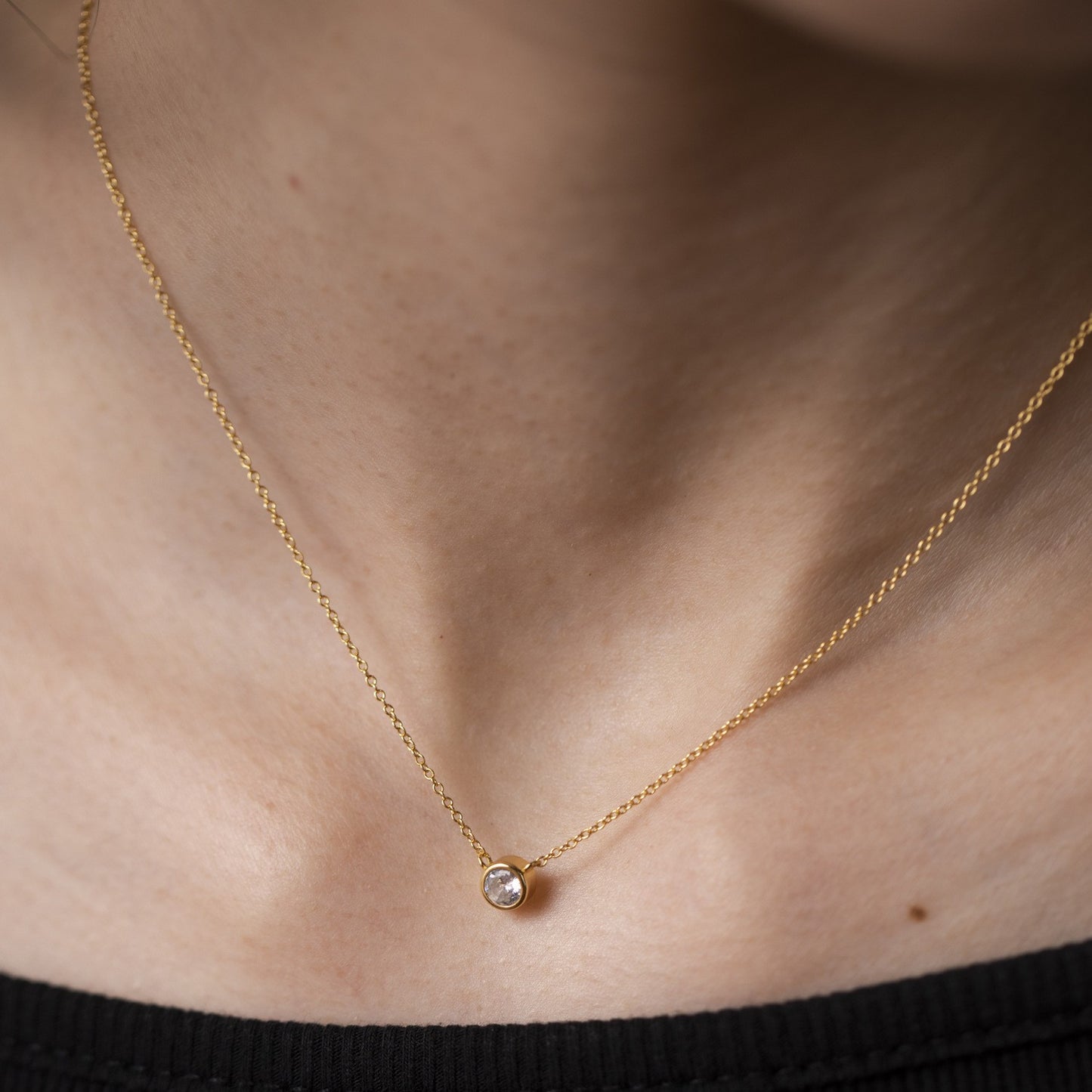 Bezel-set solitaire cz necklace - worn on neck