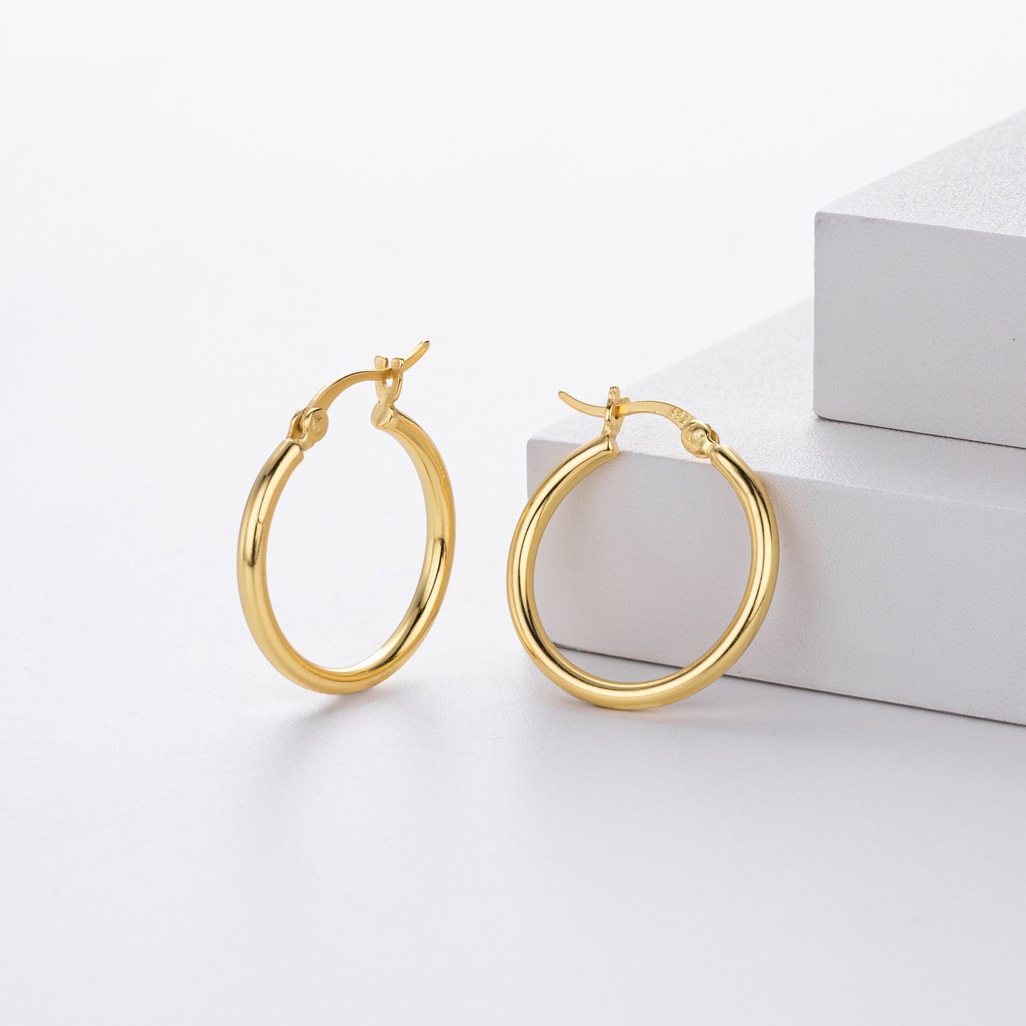 Close-up view of gold plated plain hoop earrings