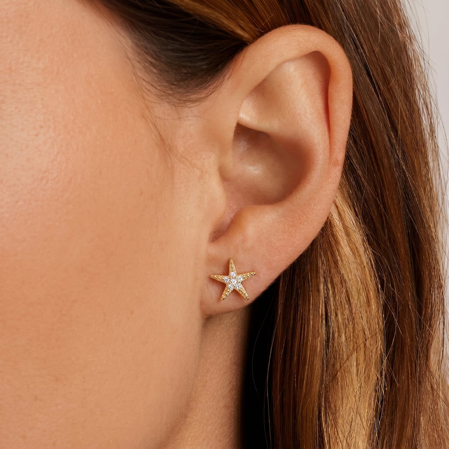 Cz starfish stud earrings - worn on ear