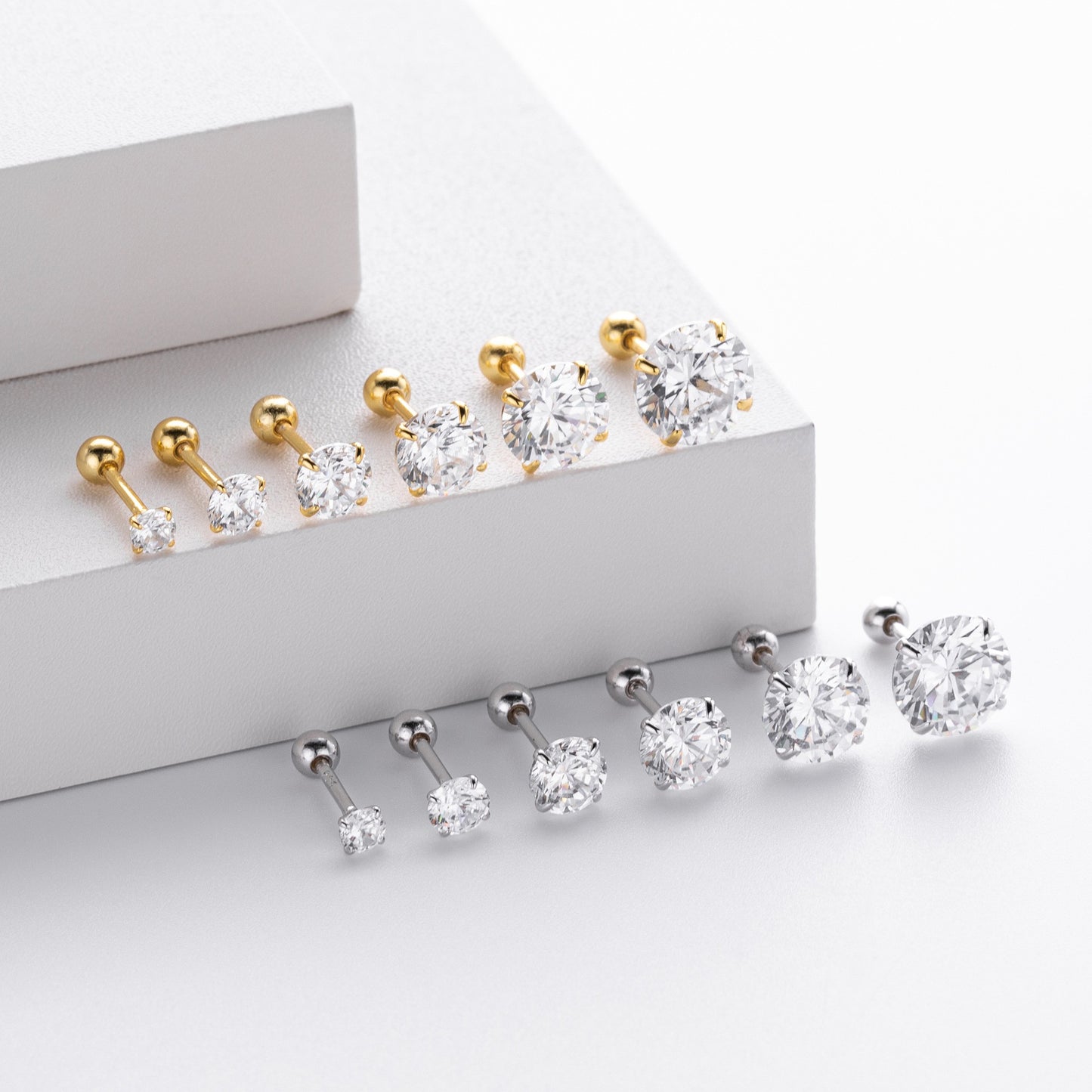 Different sizes of gold plated 4-prong round cz stud earrings with ball screw back