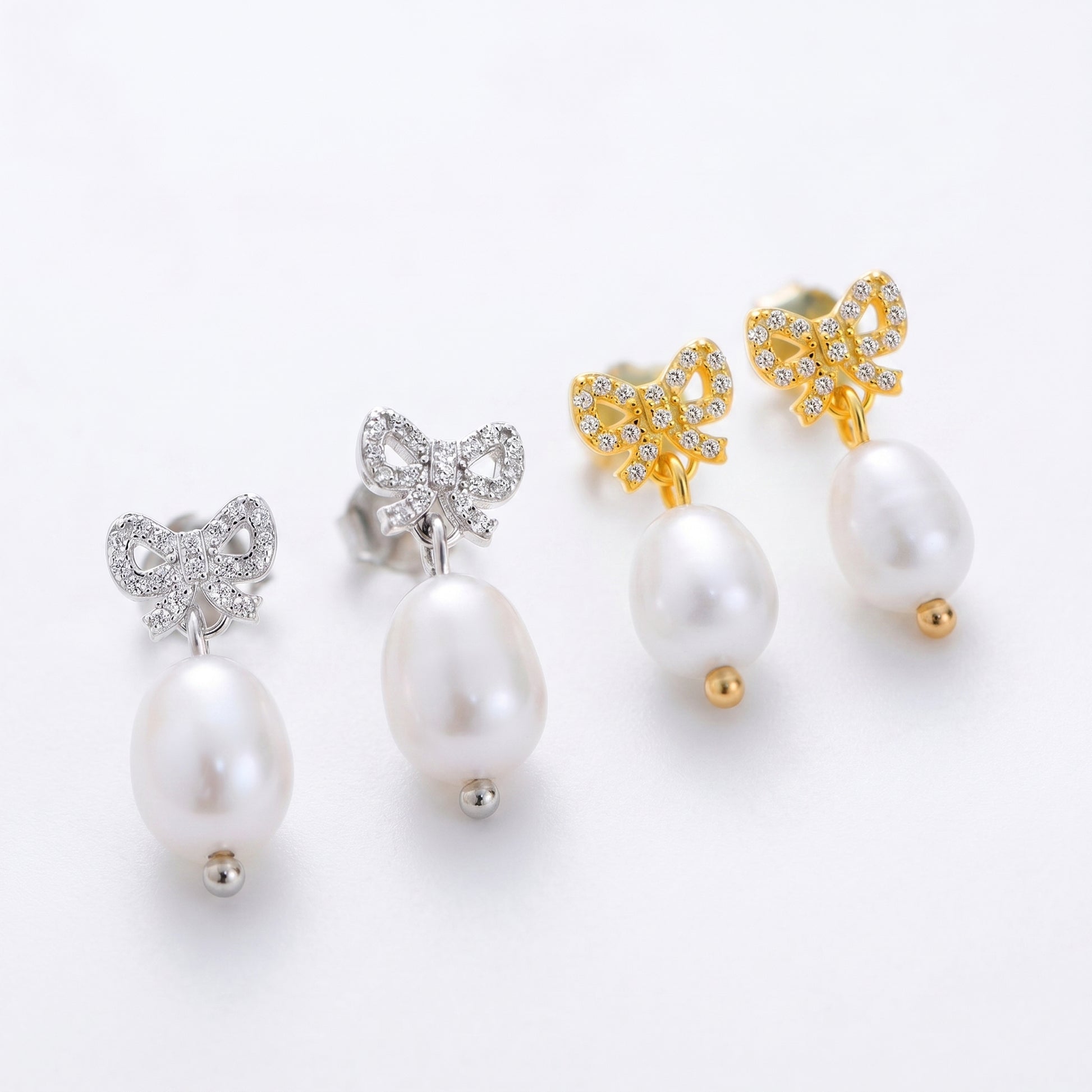 Gold and silver bow cz freshwater pearl drop earrings collection