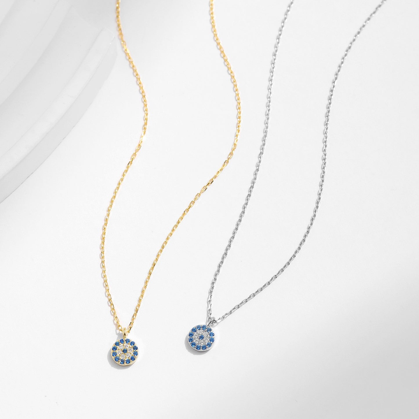 Gold and silver evil eye necklace comparison