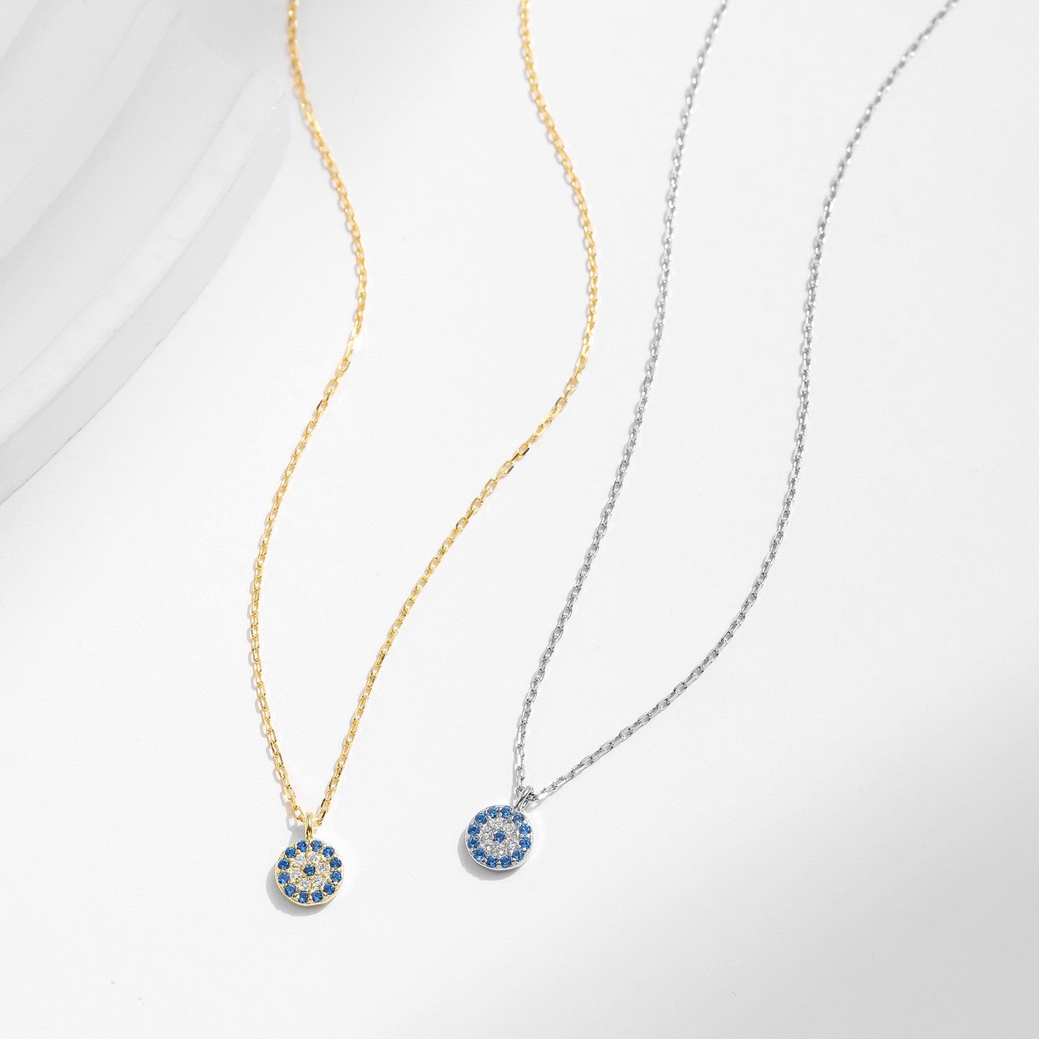 Gold and silver evil eye necklace comparison