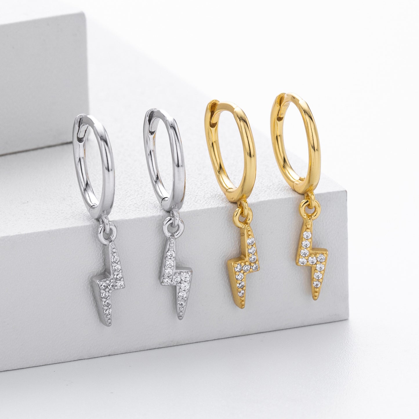 Gold and silver lightning bolt cz drop hoop earrings collection