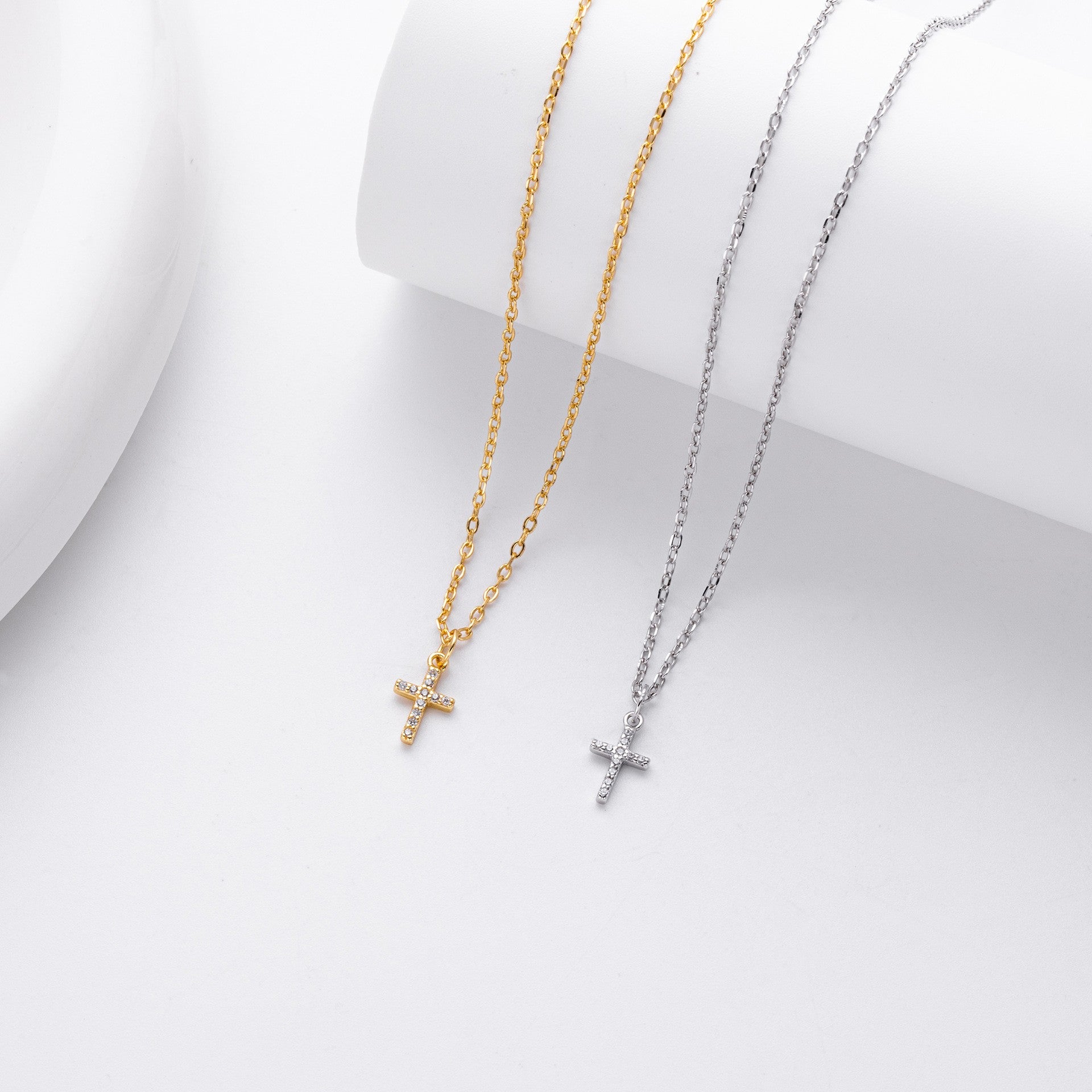 Gold and silver pave cross necklace comparison
