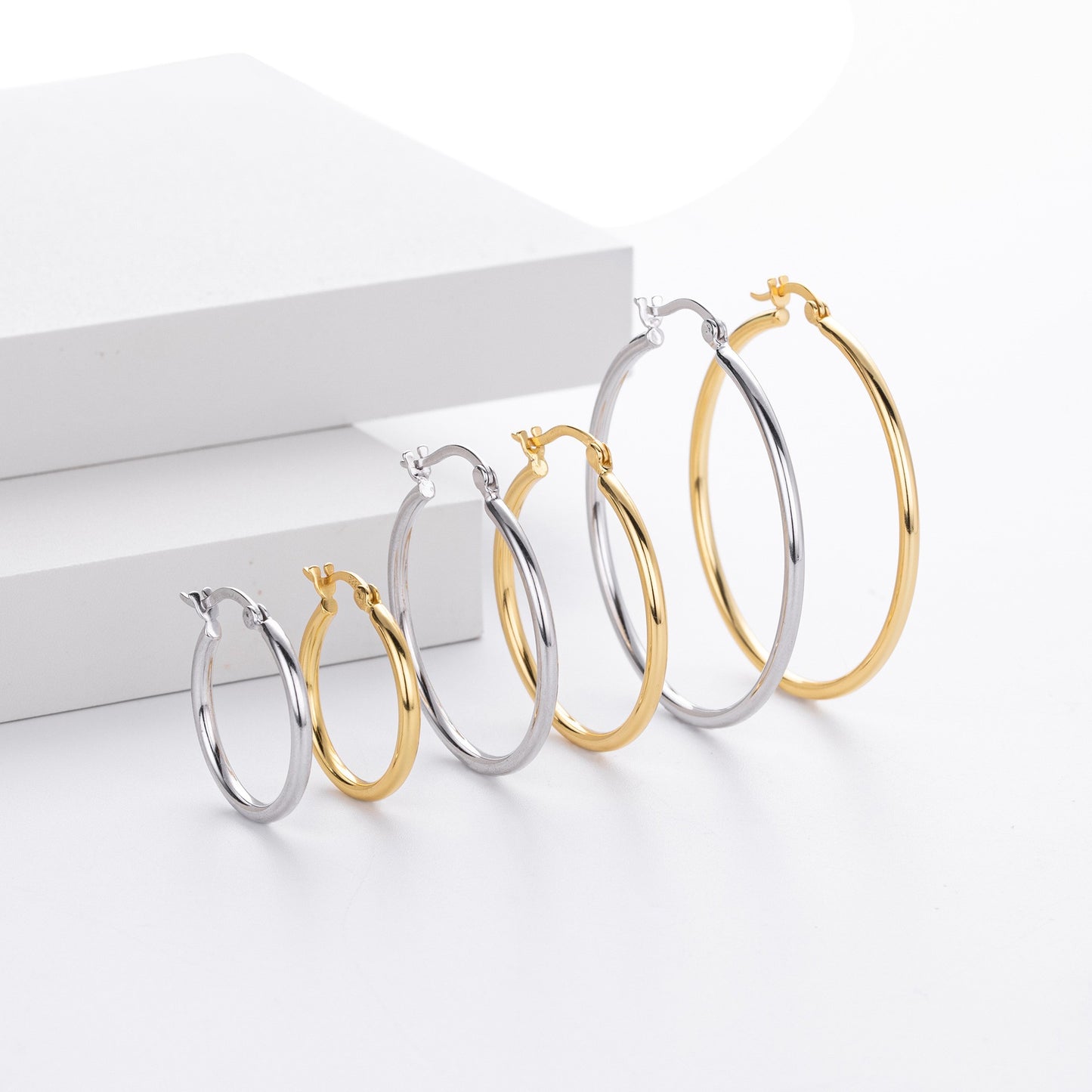 Gold and silver plain hoop earrings size comparison