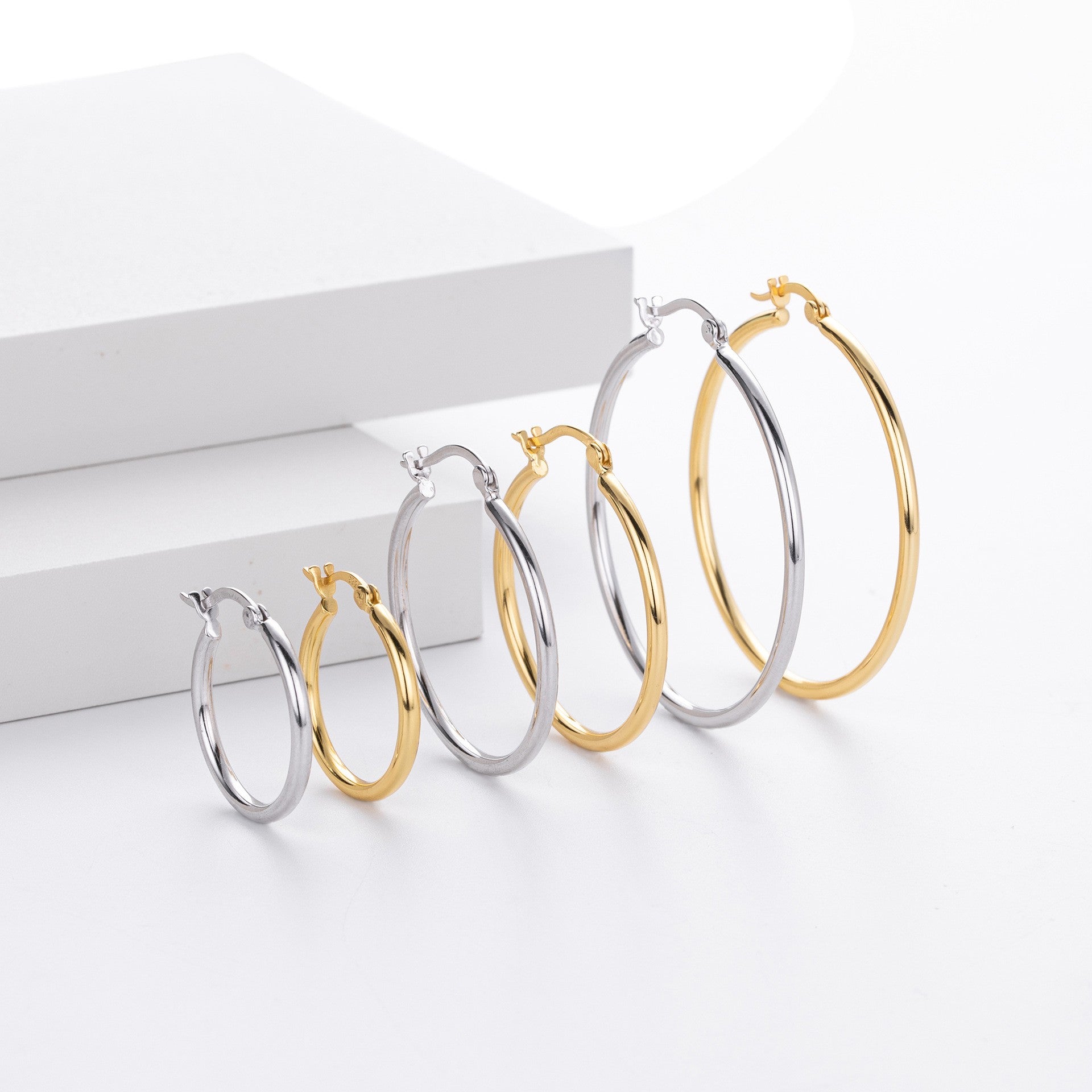 Gold and silver plain hoop earrings size comparison