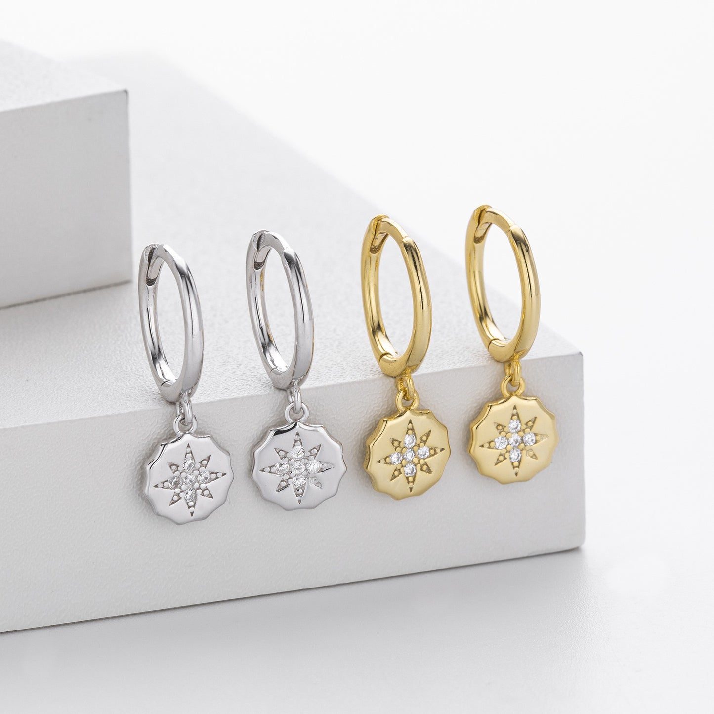Gold and silver starburst cz drop hoop earrings collection