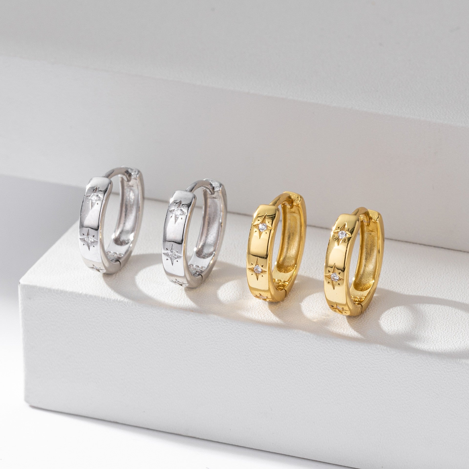 Gold and silver starburst cz huggie hoop earrings comparison