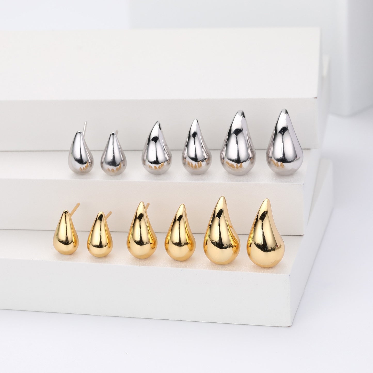 Gold and silver teardrop stud earrings collection
