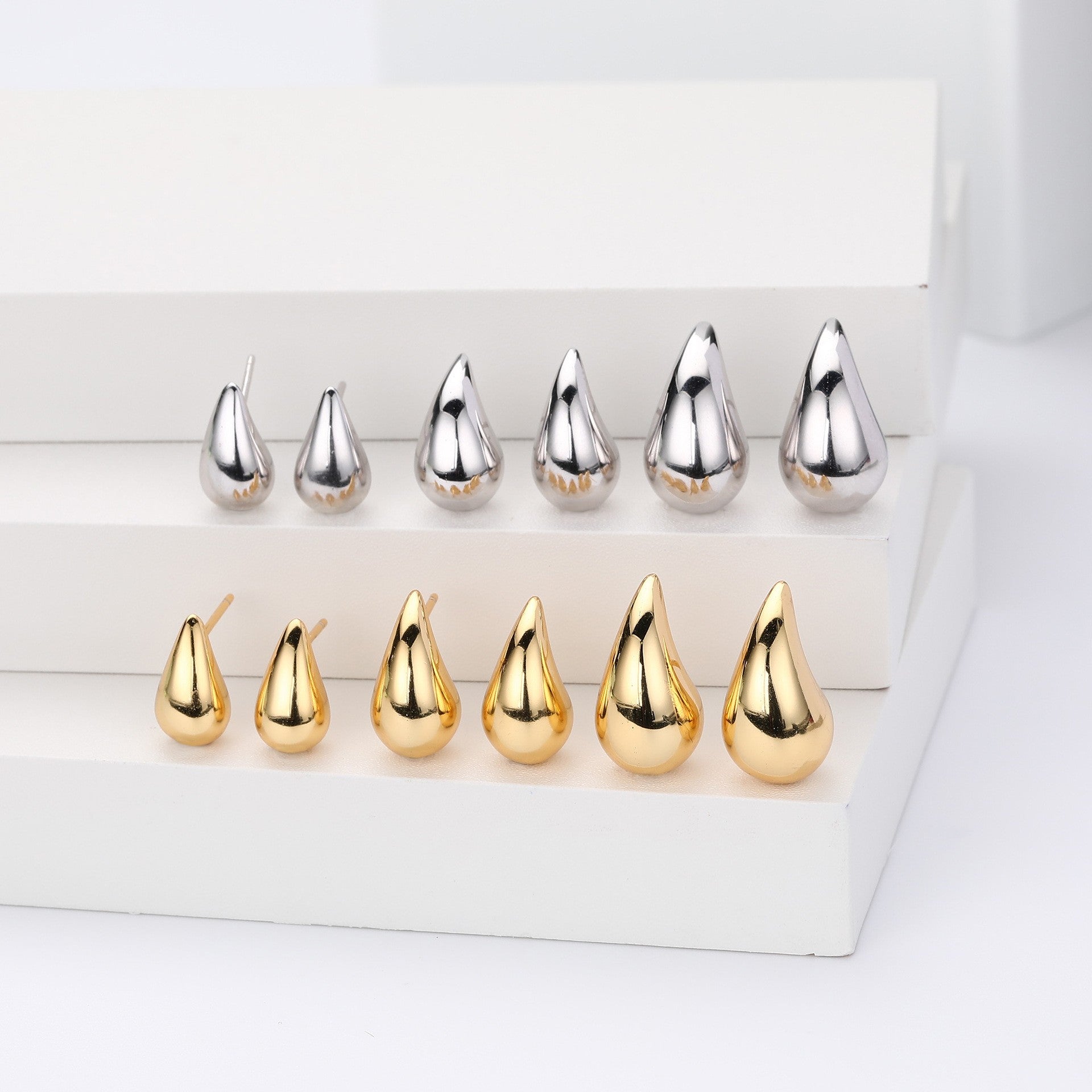 Gold and silver teardrop stud earrings collection