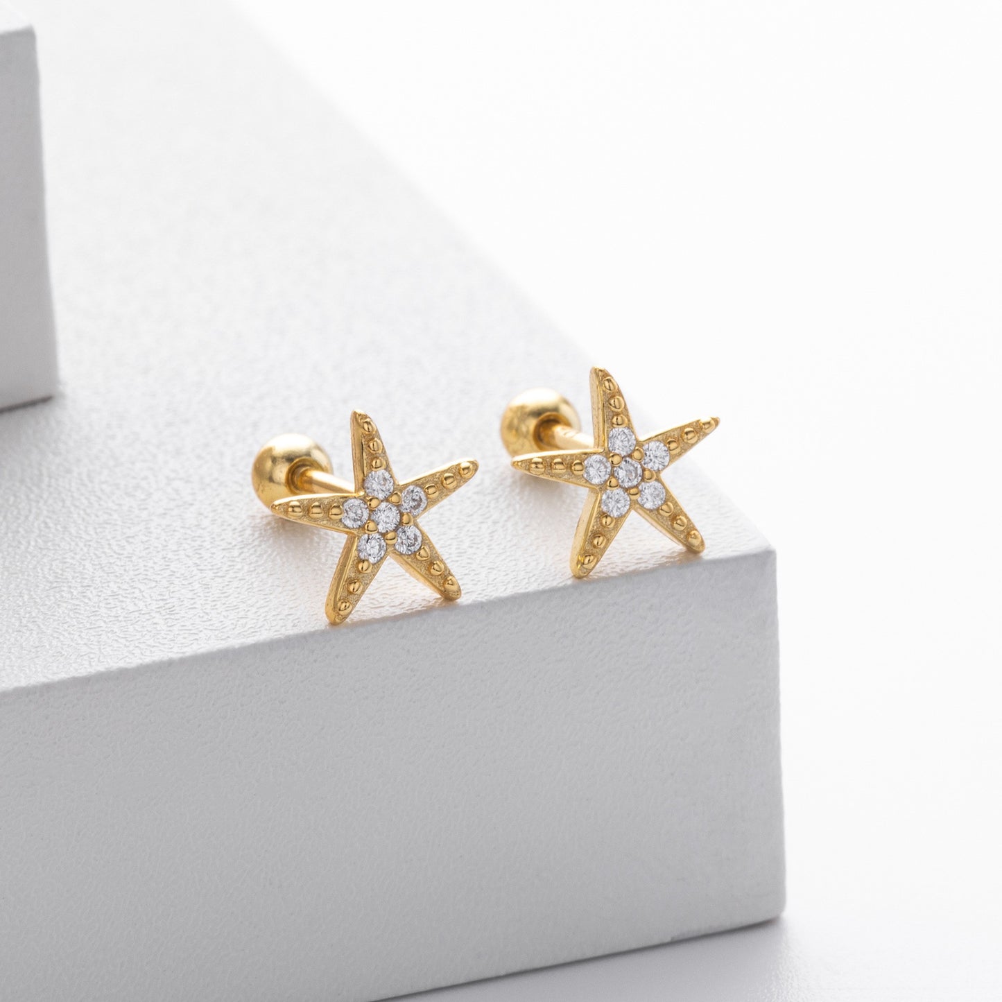Gold plated cz starfish stud earrings close-up