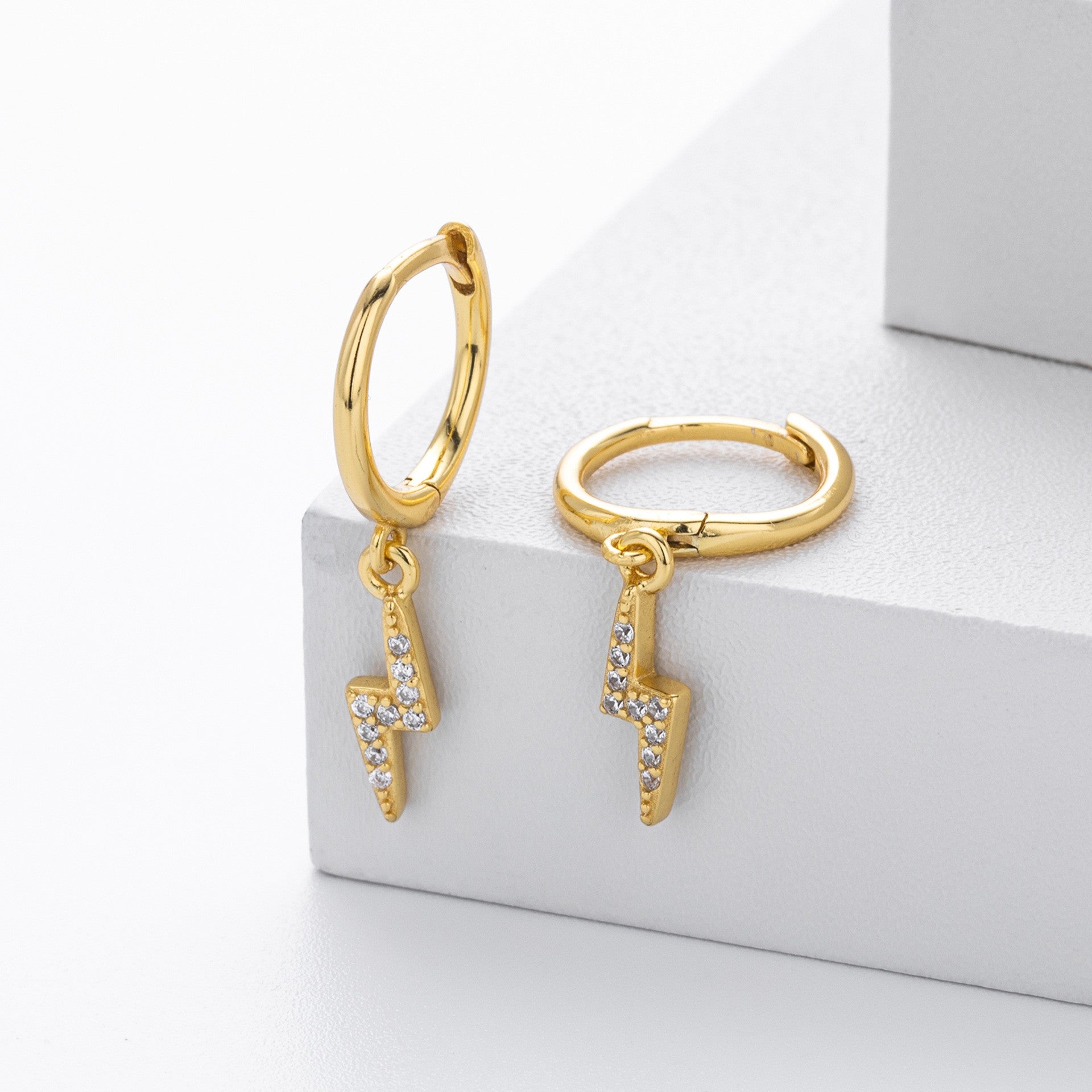 Gold plated lightning bolt cz drop hoop earrings close-up