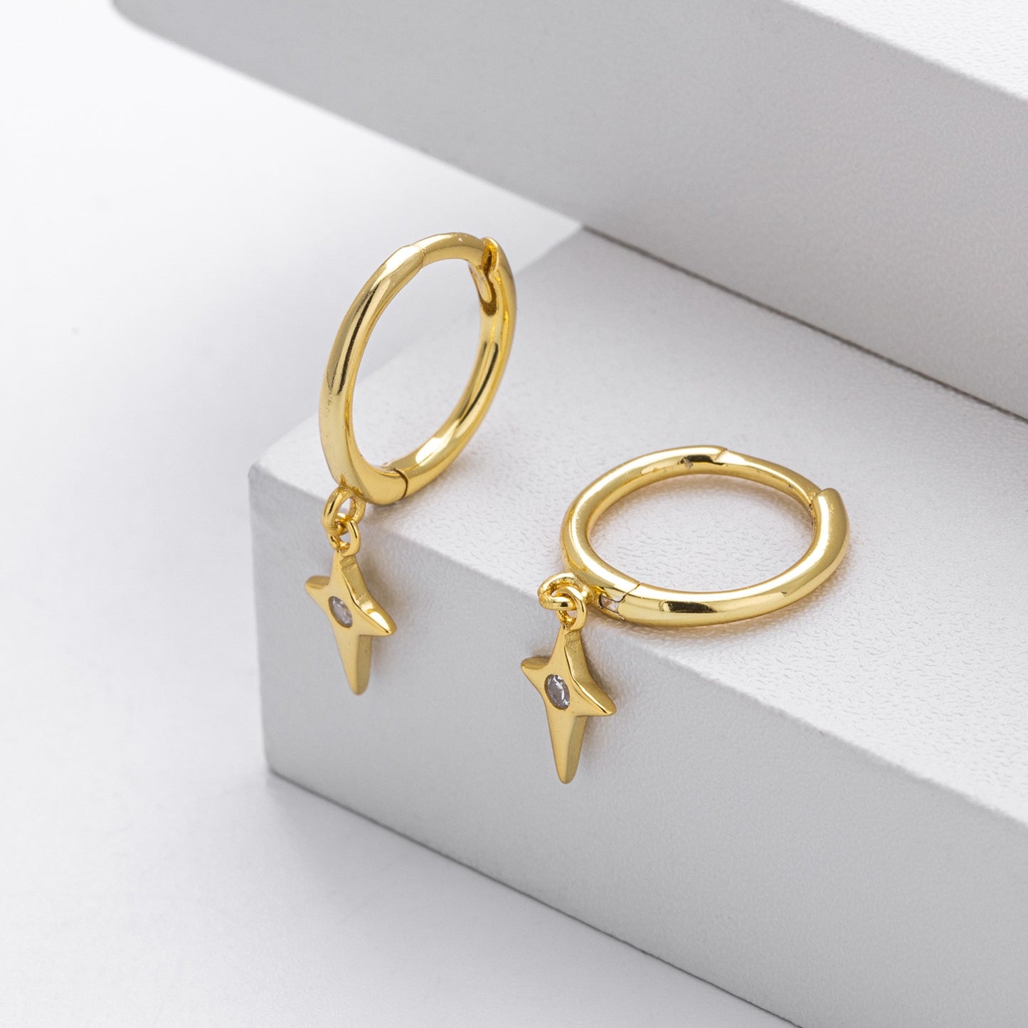 Gold plated north star cz drop hoop earrings close-up