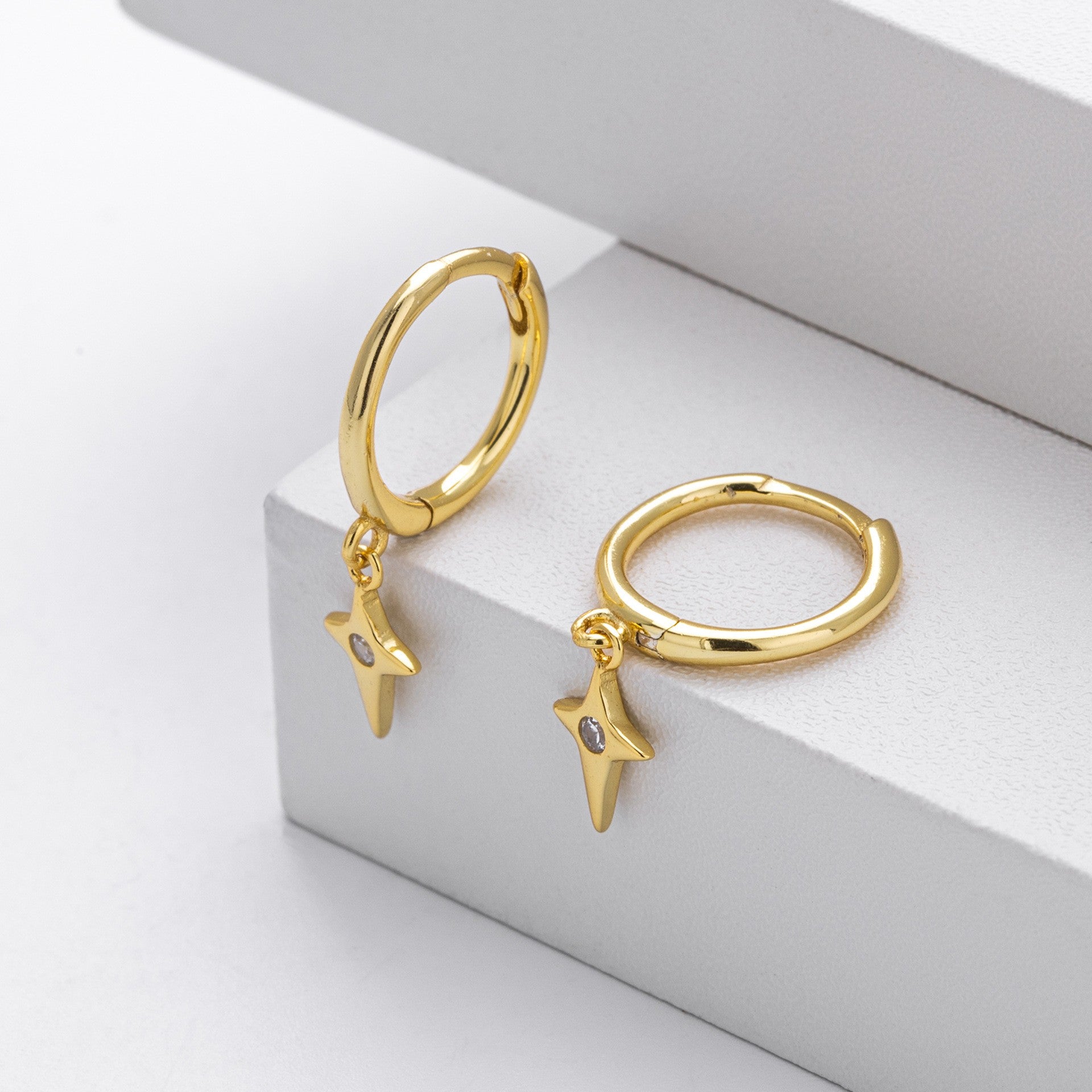 Gold plated north star cz drop hoop earrings close-up