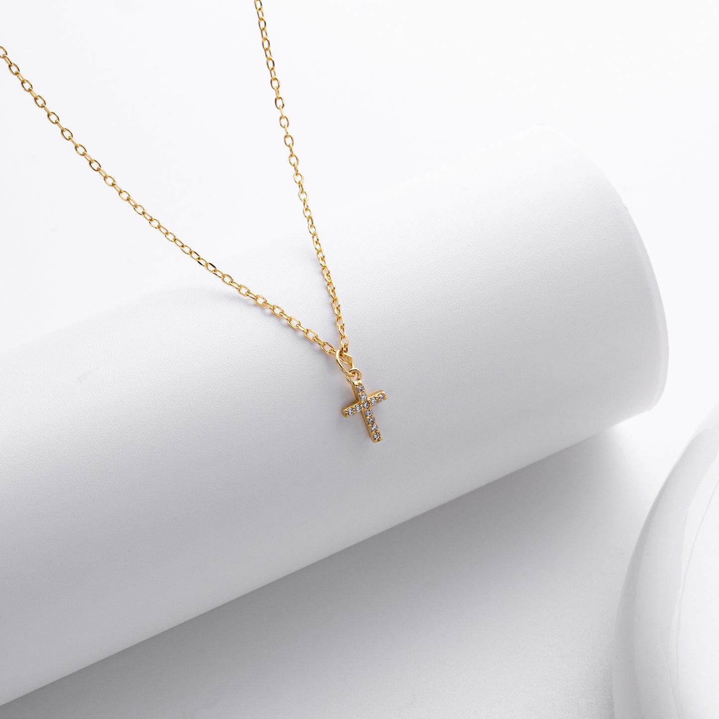 Gold plated pave cross necklace close-up