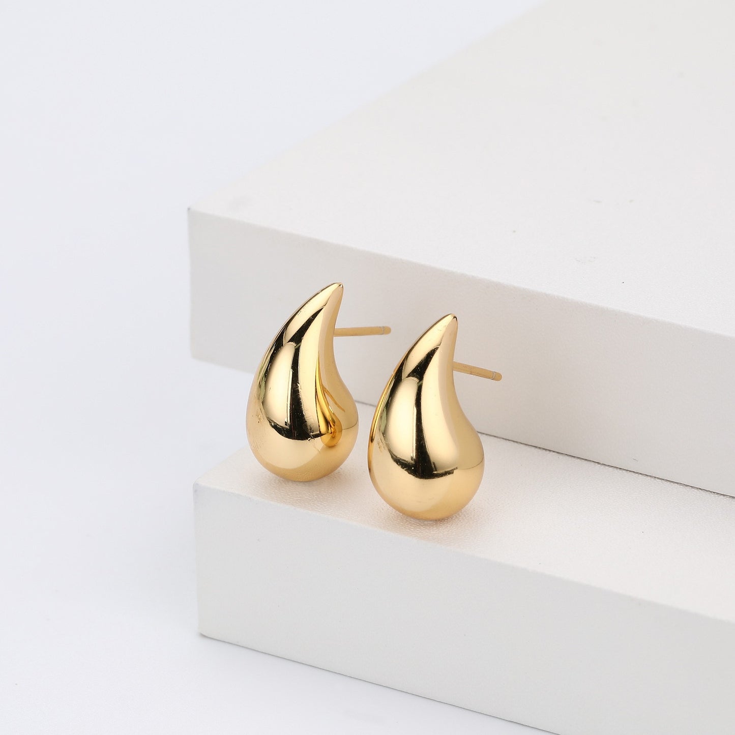 Gold plated teardrop stud earrings close-up