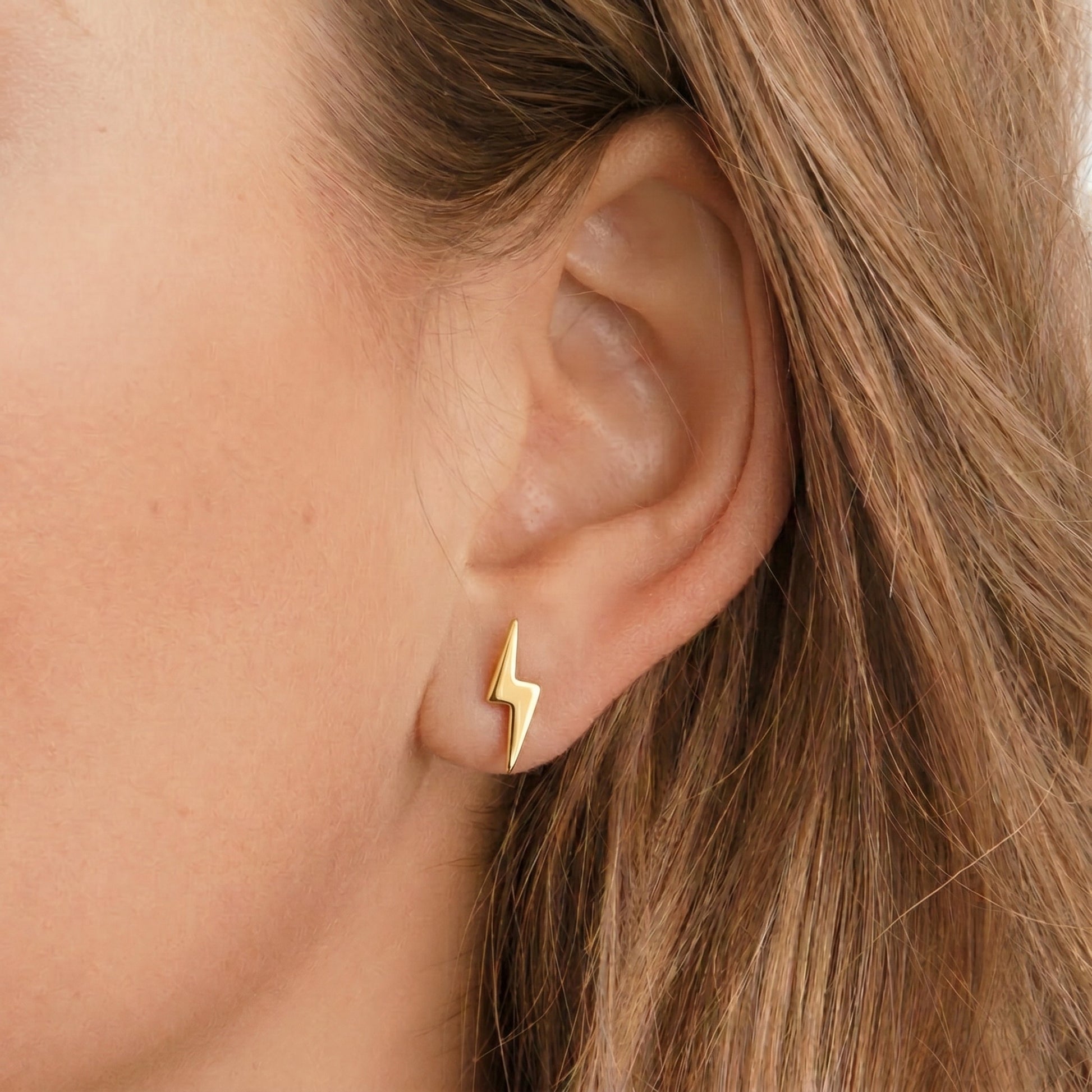 Lightning bolt stud earrings - worn on ear