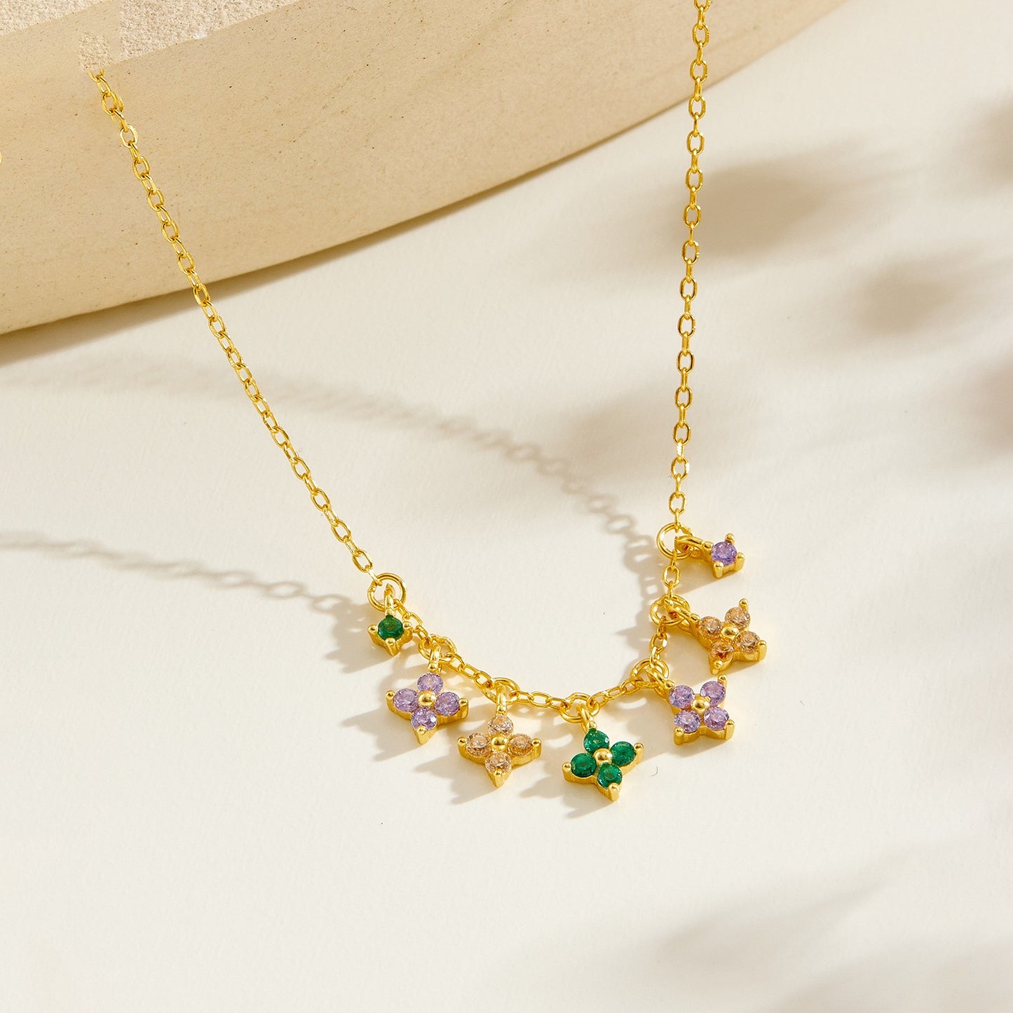 Gold plated multi-color clover charm necklace - side view