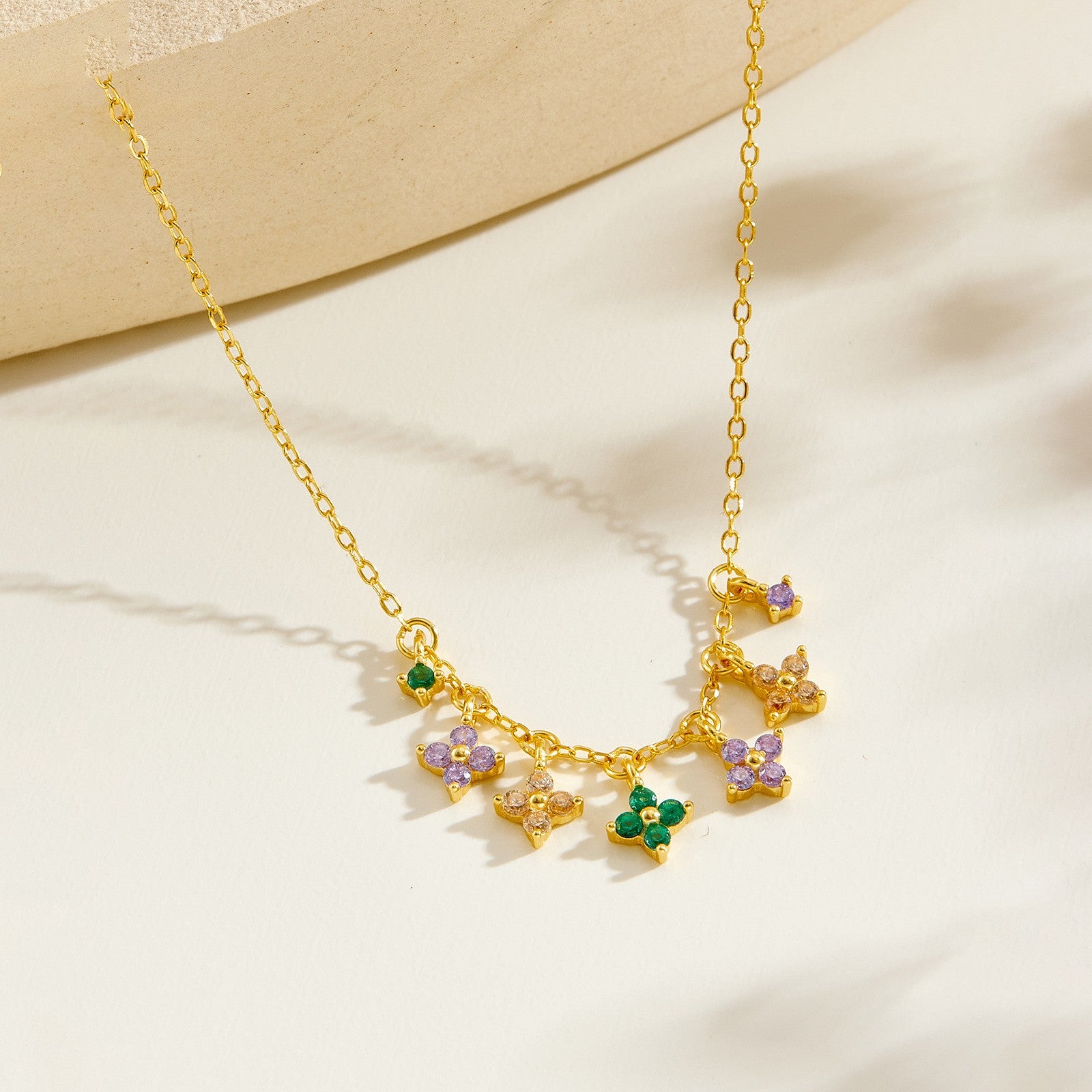 Gold plated multi-color clover charm necklace - side view