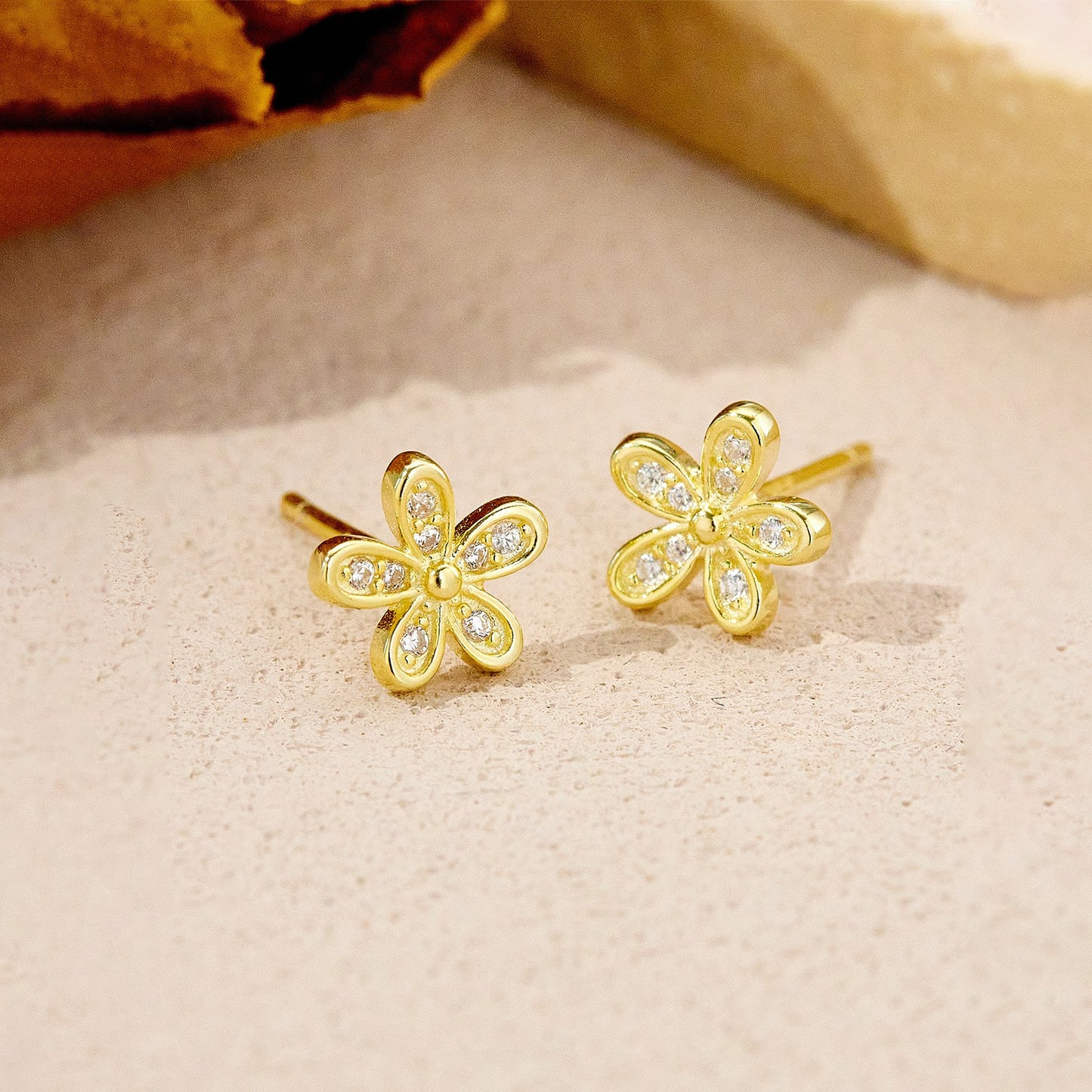 Gold plated flower cz stud earrings close-up