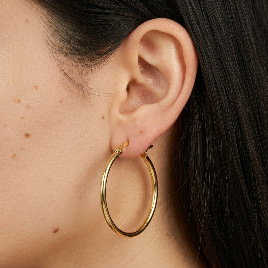 Plain gold hoop earrings - worn on ear